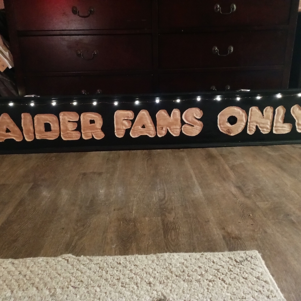 Man cave raiders sign